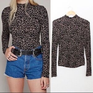 Free People Leopard print mock neck long sleeve shirt with button back